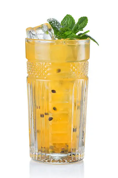 Yellow alcohol cocktail with passionfruit isolated on white background