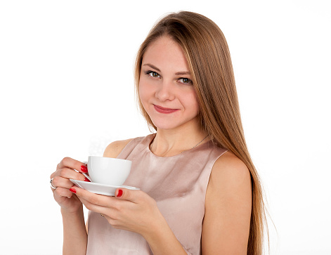 Positive attractive blonde with cup of coffee on white background