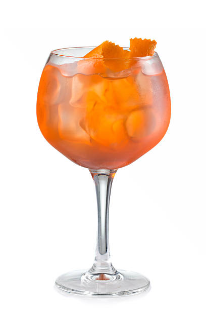 istock Fruit alcohol cocktail with orange slice isolated on white 518590260