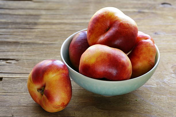 istock fig peaches sweet and ripe on a wooden table 518590937