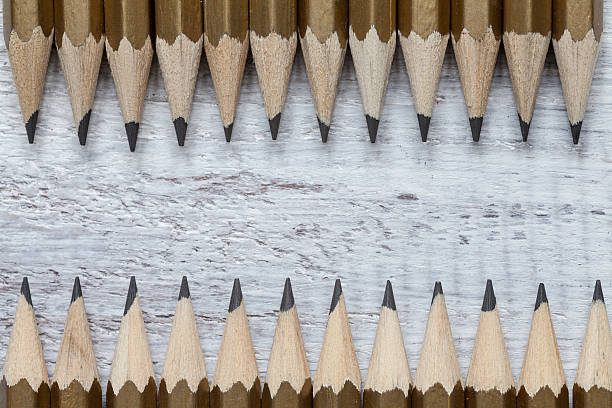 istock Pencil on wooden background 518591558