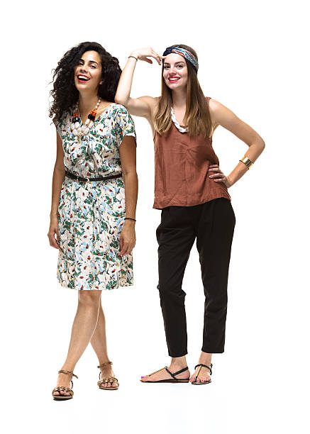 istock Two cheerful women standing looking at camera 518591975