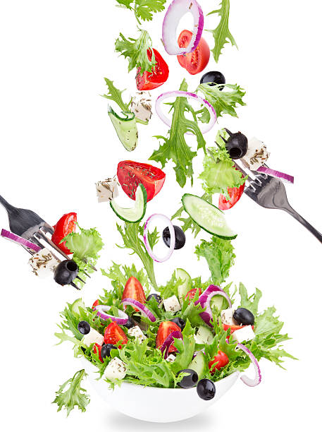istock Fresh salad with flying vegetables ingredients 518593709