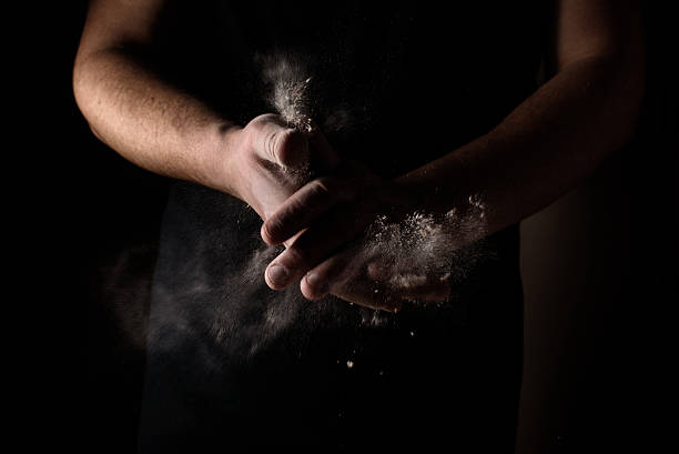 istock In the men's hands dough and flour 518593960