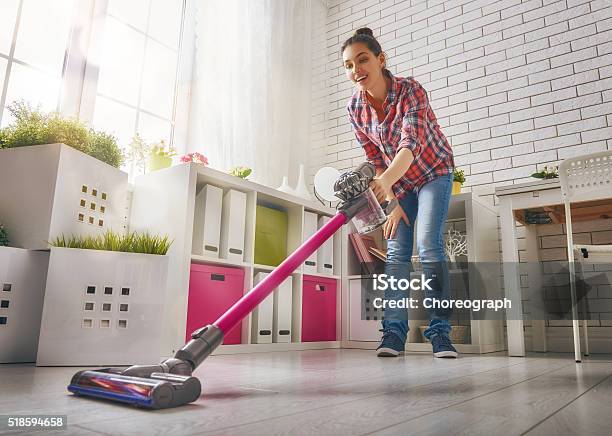 Woman Vacuums The Floor Stock Photo - Download Image Now - Vacuum Cleaner, Women, One Woman Only