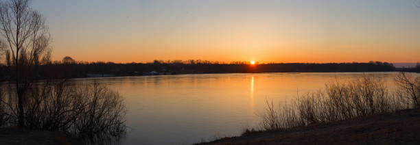 istock Beautiful landscape with old willow tree at sunrise. River 518594912