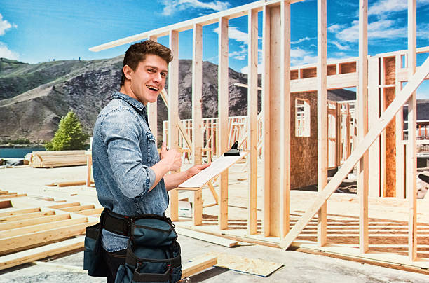 Smiling building contractor working outdoor Smiling building contractor working outdoorhttp://www.twodozendesign.info/i/1.png 24 x 24 frame stock pictures, royalty-free photos & images