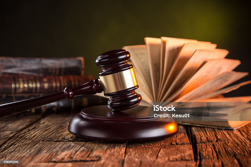 Wooden gavel and books on wooden table Wooden gavel and books on wooden table, law concept Book Stock Photo