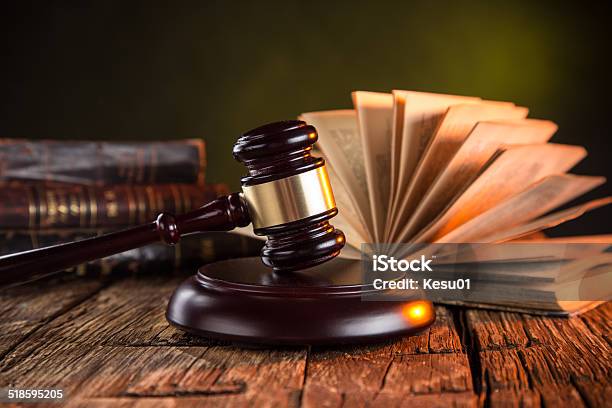 Wooden Gavel And Books On Wooden Table Stock Photo - Download Image Now - Book, Close-up, Crime