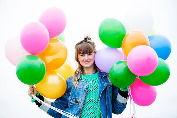 istock girl with balloons 518595349