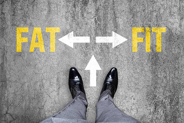 istock Man confuse which way to go Fat or Fit 518595812