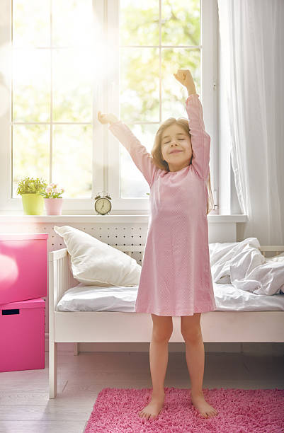 istock girl wakes up 518596018