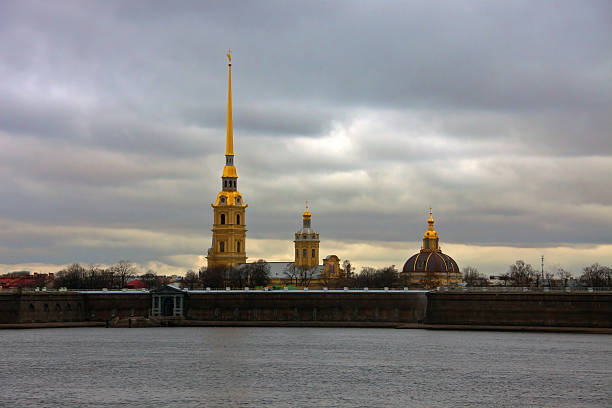 Peter and Paul fortress and Cathedral View of the Peter and Paul fortress and Cathedral from the river Neva. St. Petersburg Russia; Петропавловская крепость и собор peter and paul cathedral st petersburg stock pictures, royalty-free photos & images