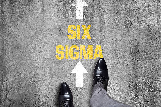 istock Top view of a businessman following Six Sigma text 518599088