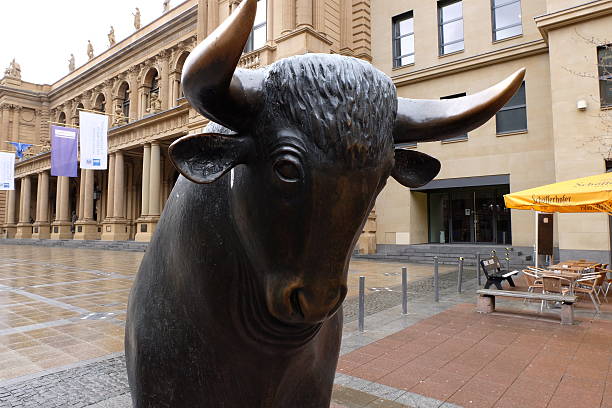 Frankfurt, Germany – March 30th, 2016: Frankfurt Stock Exchange is located at the Börsenplatz. The bronze bull monument exists since 1988.