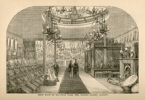 London, England - December 5, 2015: The interior of the showroom of Mr Swan Nash, Furnishing Ironmonger, of 253 Oxford Street, London - part of an advertisement section in “Peter Parley’s Annual for 1865”, William Kent & Co, 1864. The showroom contains luxury items such as baths, perdoniums, kettles, lamps, fireplaces, chests etc. Image scanned on 13 October 2015 and modified 5 December 2015.