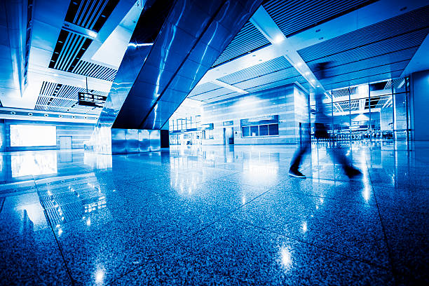 istock People in blurred motion at airport 518614096