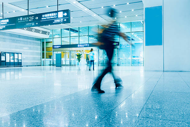 People in blurred motion at airport shanghai hongqiao  airport. Blurred out people in motion. adobe rgb 1998 use........... business architecture blue people stock pictures, royalty-free photos & images