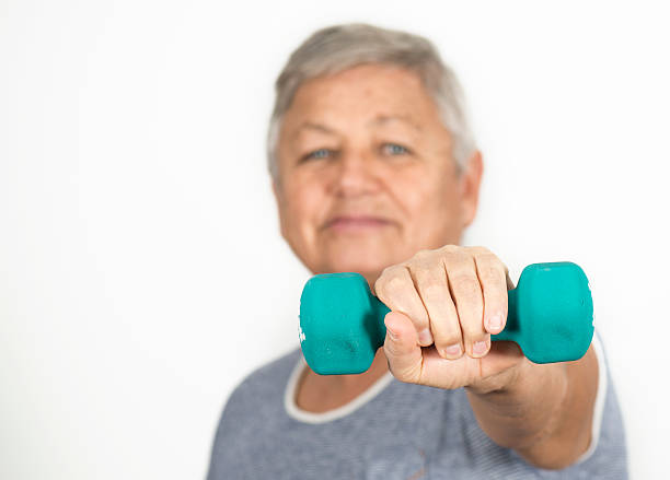 istock Senior Woman Lifting Dumbbell 518614634