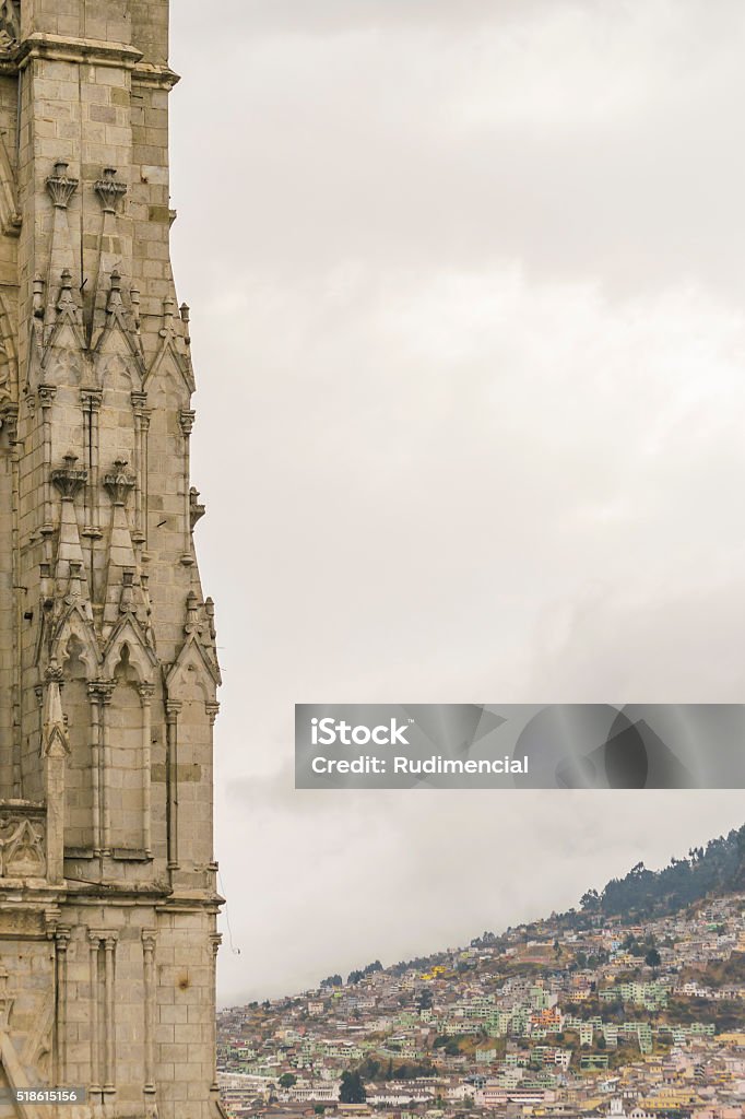 San Juan Basilica Quito Ecuador Low angle detail view of neo gothic style San Juan Basilica and cityscape at background at historic center of Quito, Ecuador Architecture Stock Photo