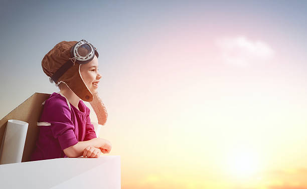 istock girl plays astronaut 518616394