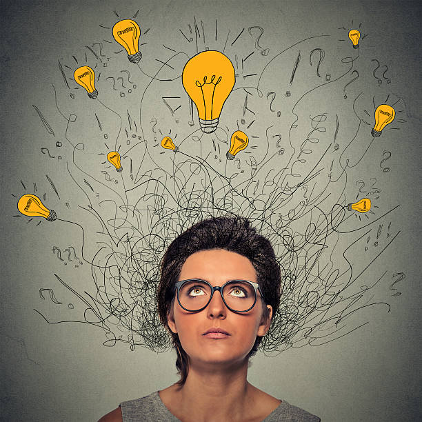 istock thinking woman with question signs and lightbulbs above head 518616518