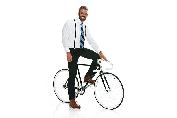 istock Smiling businessman riding bicycle 518616710