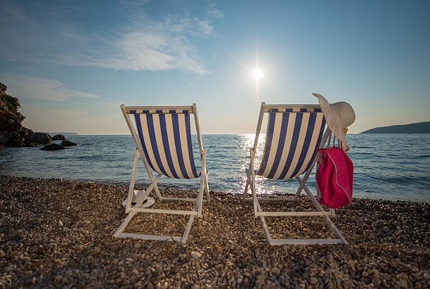 istock Striped outdoor chairs on shore at Vis island 518618058
