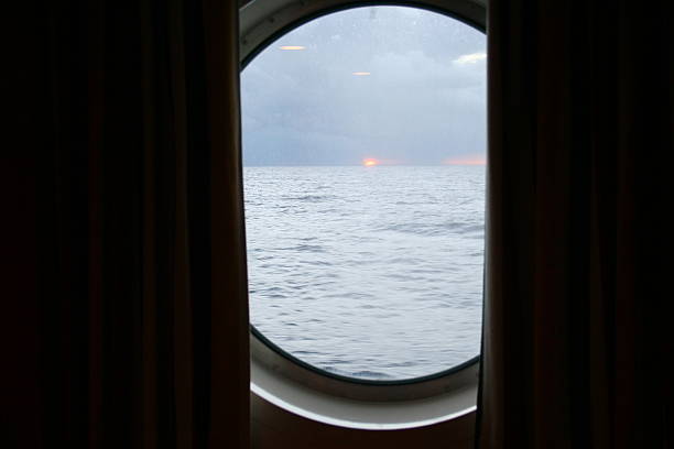 istock sunrise through a cruise ship portal 518618714