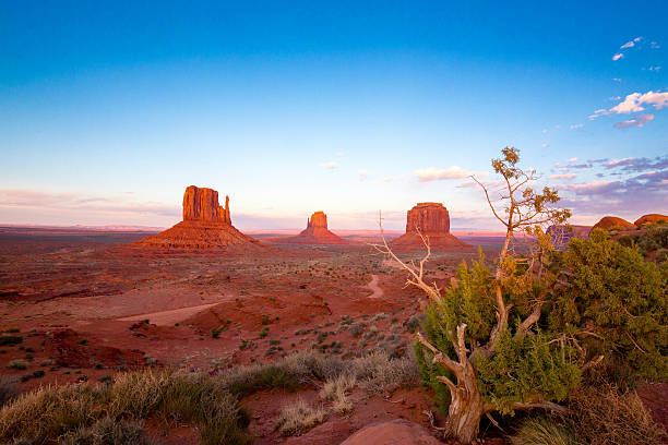 Monument Valley Utah after Sunset A shot of famous Mittens in Monument Valley merrick butte stock pictures, royalty-free photos & images