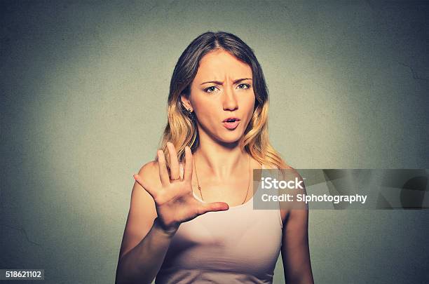 Angry Annoyed Woman Raising Hand Up To Say No Stop Stock Photo - Download Image Now - Women, Disgust, Stop Gesture