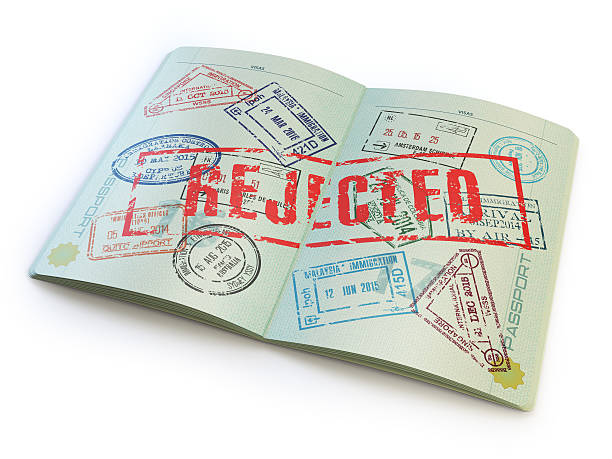 istock Passport with rejected visa stamp isolated on white. 518621296