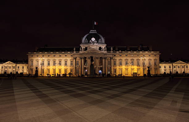 Military School by night in Paris The Military School (Ecole Militaire, 1750) by night in Paris, France ecole stock pictures, royalty-free photos & images
