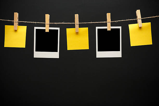 istock Vintage pictures and Sticky Note on black background 518623757