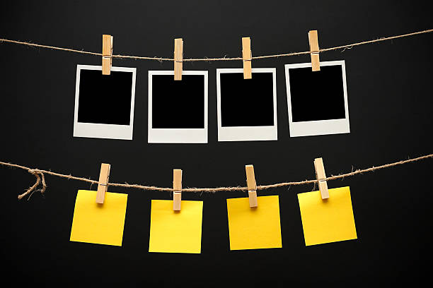 istock Vintage pictures and Sticky Note on black background 518623785