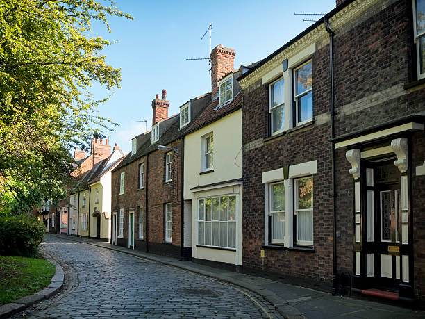 Old houses in Pilot Street, King's Lynn Old terraced houses and former shops in Pilot Street, an historic area of the port of King’s Lynn in Norfolk, eastern England.  kings lynn stock pictures, royalty-free photos & images