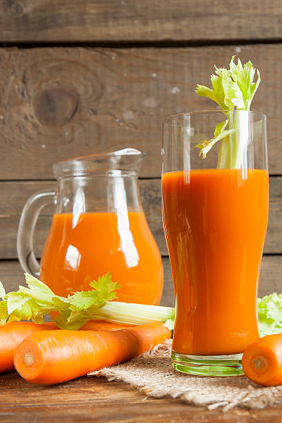 istock Fresh carrot juice with carrots and celery 518626368