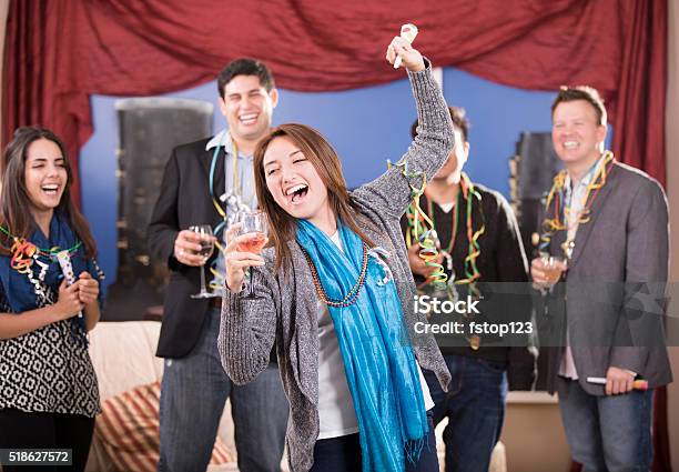 New Years Eve Celebration Multiethnic Group Of Friends Party Dancing Stock Photo - Download Image Now