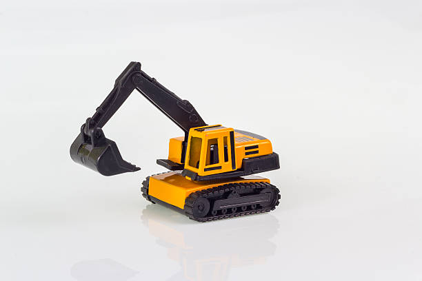isolated on white of miniature toy excavator
