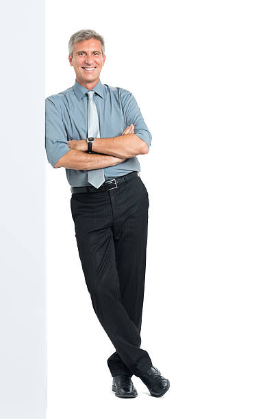 istock Businessman Leaning Against Sign 518642209