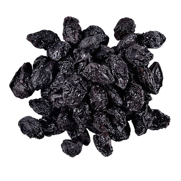 istock Heap of prunes on a white 518643101