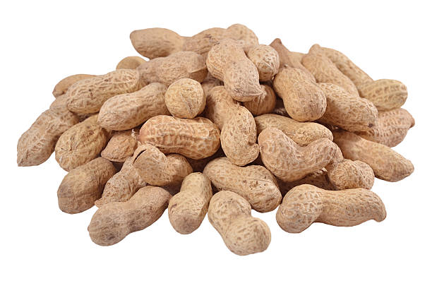 istock Heap of whole peanuts on a white 518643239