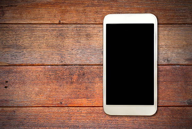 istock White smart on wooden desk 518643813