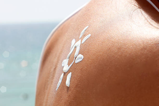 istock Sun Cream on a Woman's Shoulder 518643823