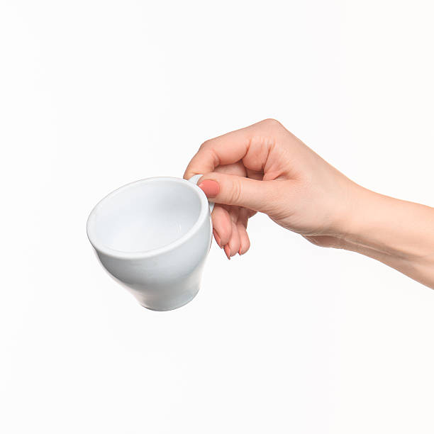 istock Woman hand with cup on white background 518649330