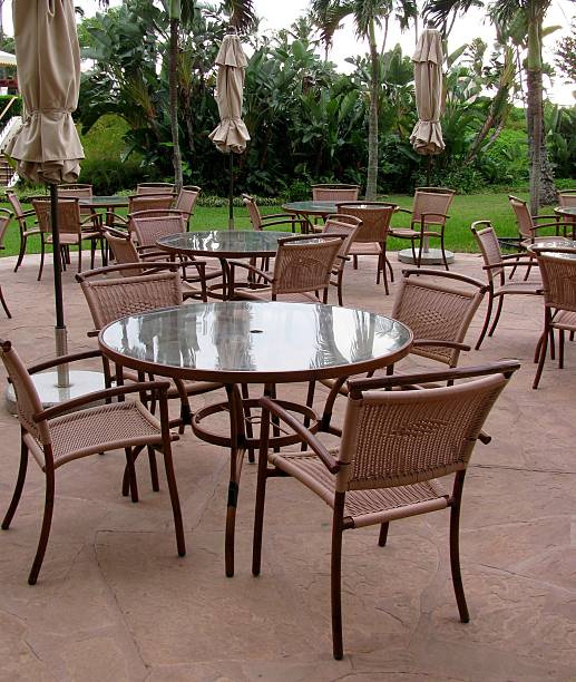 istock Tables, umbrellas and chairs on an outside patio 518650250