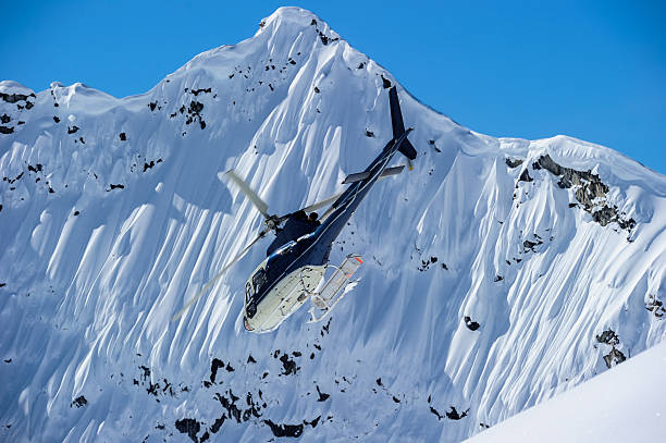 istock Helicopter flying in the mountains 518650446