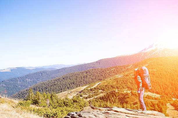 istock Girl with a backpack climbs the hill. 518650842