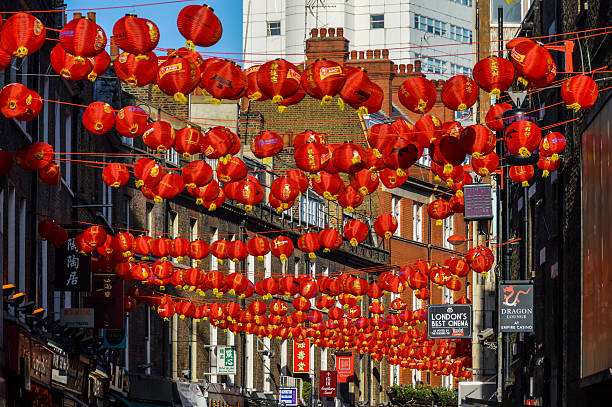 January 18, 2024 - Denver, CO, USA: A red lantern hangs from a wooden beam as decoration for the Lunar New Year.