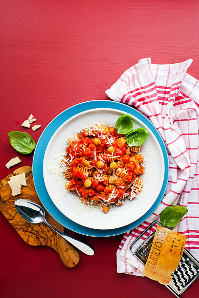 istock Healthy vegetarian Italian pasta on bright background 518651636